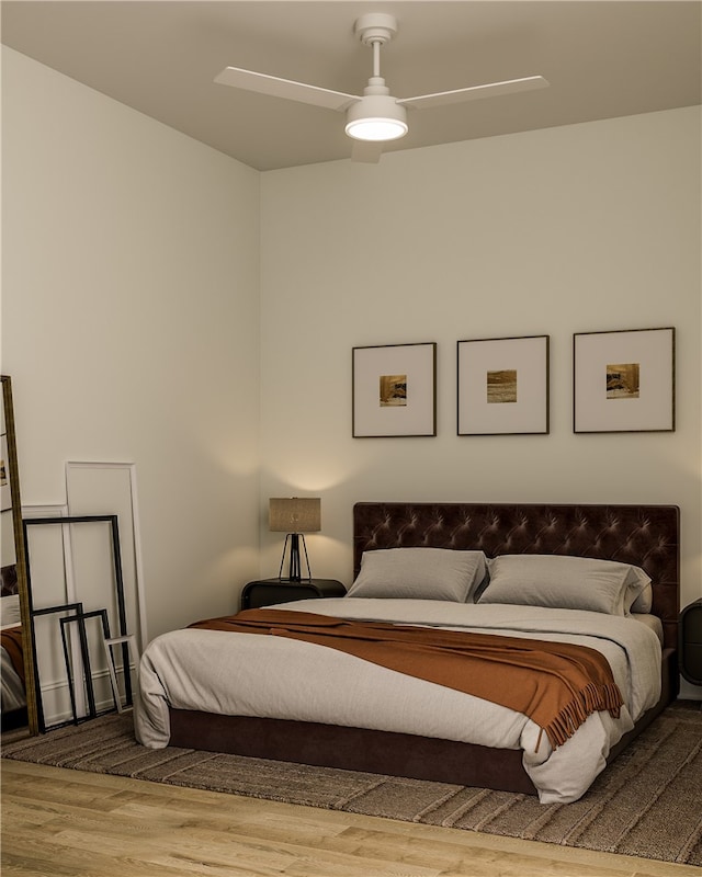 bedroom with hardwood / wood-style flooring and ceiling fan