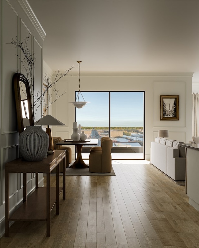 interior space with crown molding and wood-type flooring