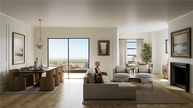 living room featuring light hardwood / wood-style floors and crown molding