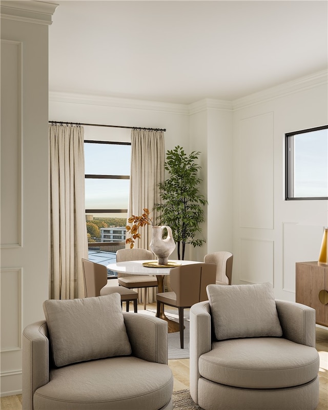 sitting room featuring crown molding and a wealth of natural light