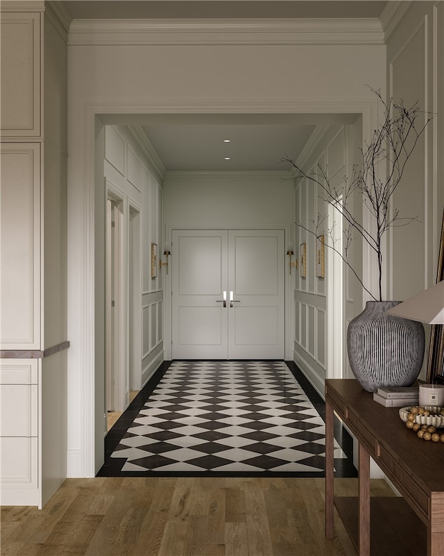 hallway with wood-type flooring and crown molding