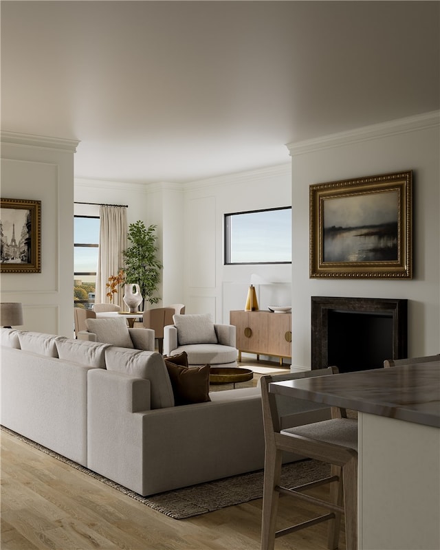 living room featuring a fireplace, light hardwood / wood-style flooring, and ornamental molding