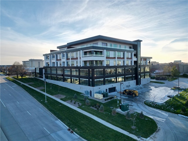 view of outdoor building at dusk