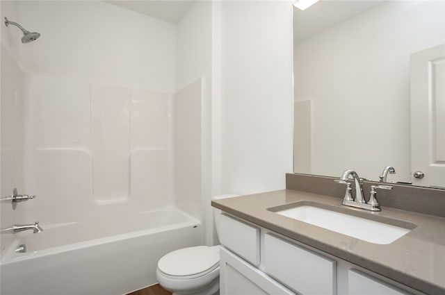 full bathroom with shower / tub combination, vanity, and toilet