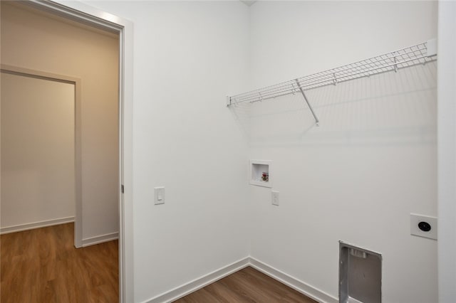 laundry area with hookup for an electric dryer, dark hardwood / wood-style flooring, and hookup for a washing machine