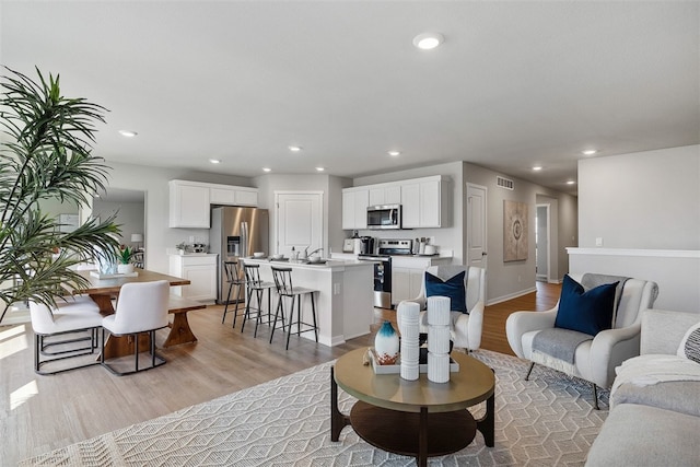 living room with light hardwood / wood-style floors