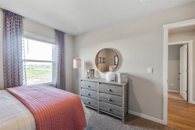 bedroom with light wood-type flooring