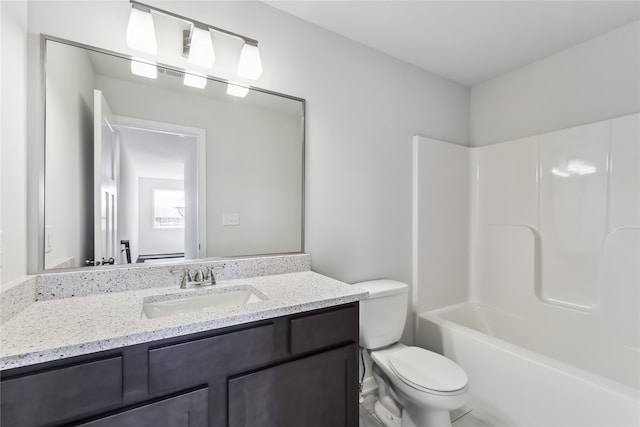 full bathroom featuring shower / tub combination, vanity, and toilet