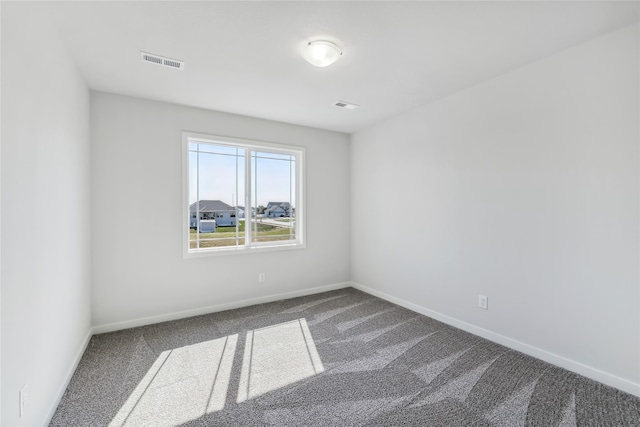 spare room featuring carpet floors