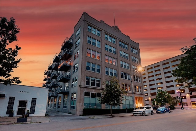 view of outdoor building at dusk