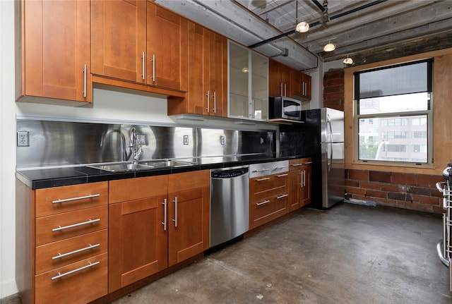 kitchen with sink, stainless steel counters, and appliances with stainless steel finishes