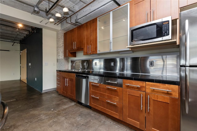 kitchen featuring sink, tile countertops, and appliances with stainless steel finishes