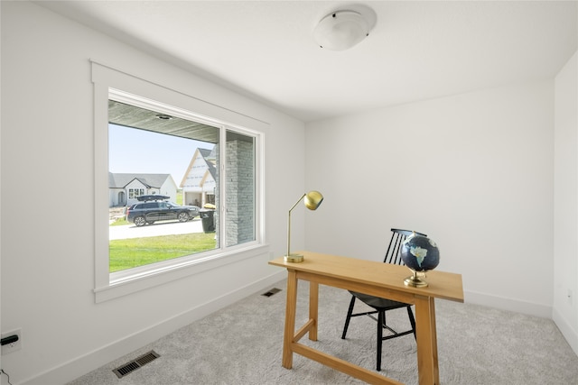 home office featuring light colored carpet