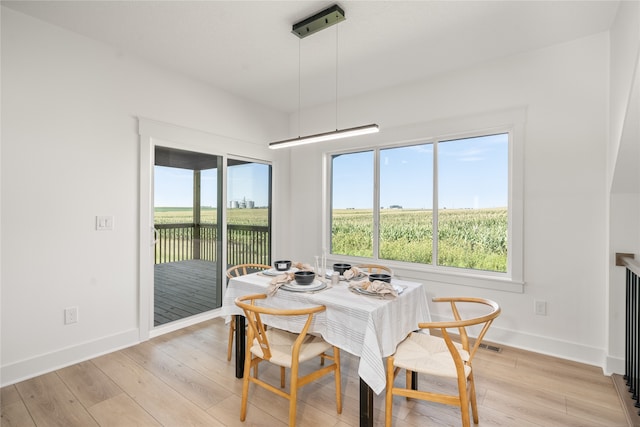 dining room with light wood-type flooring