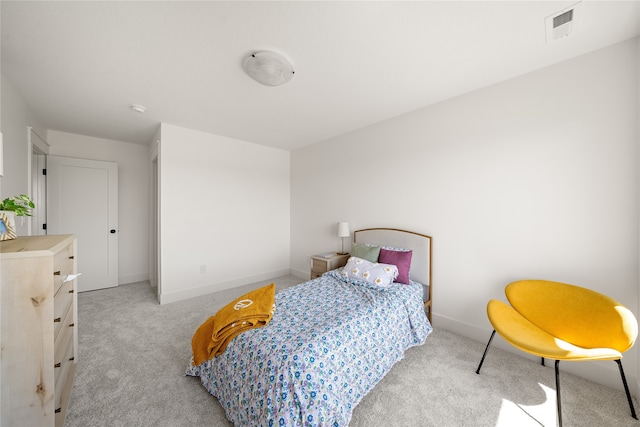 bedroom with light colored carpet