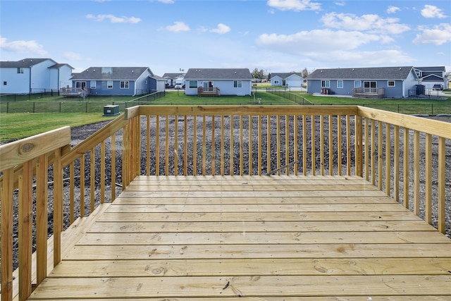 wooden deck featuring a yard