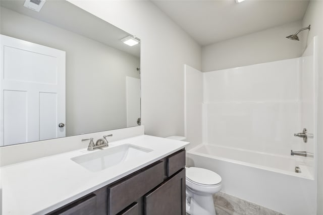 full bathroom with toilet, vanity, and tub / shower combination