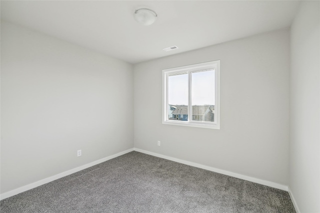 2009 White Oak Ln, Granger, IA 50109 - carpeted spare room featuring baseboards