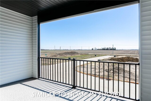 balcony featuring a rural view