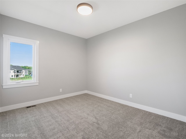 unfurnished room featuring carpet floors