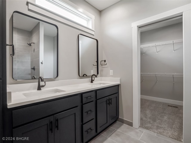 bathroom featuring tile patterned flooring and vanity