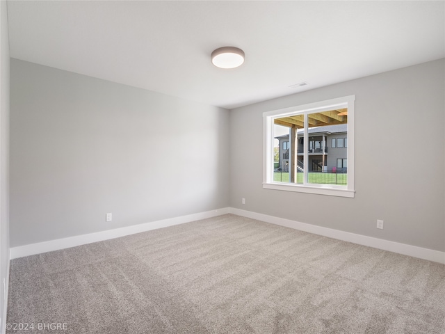 spare room featuring carpet flooring