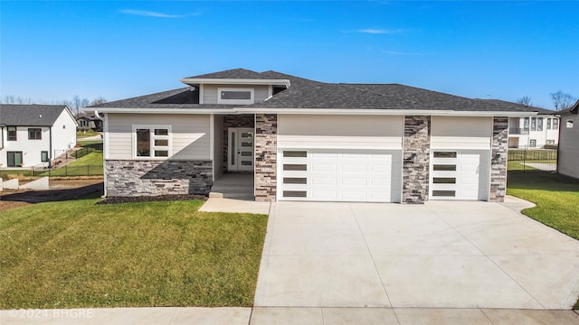 prairie-style house with a front yard and a garage