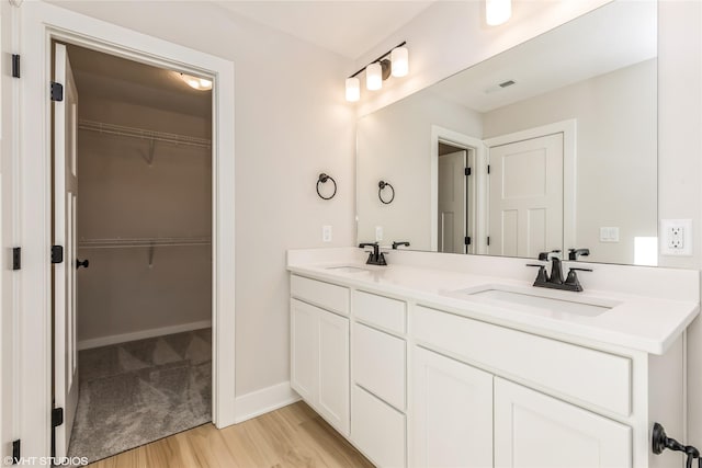 bathroom featuring vanity and hardwood / wood-style flooring