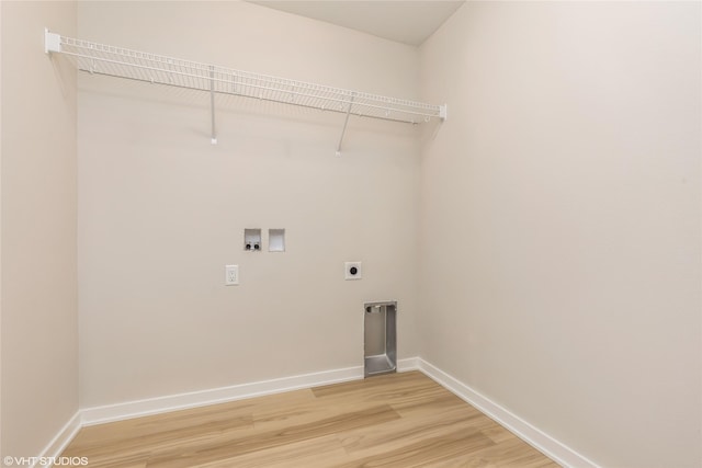 laundry area with hookup for an electric dryer, hardwood / wood-style floors, and hookup for a washing machine