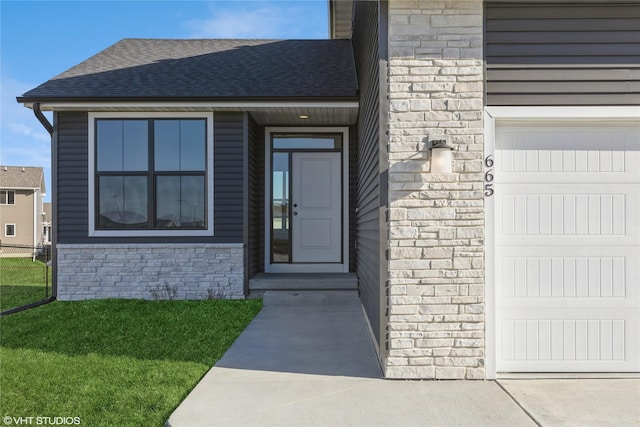 doorway to property with a lawn