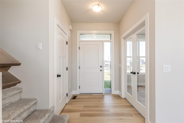 entryway with plenty of natural light and light wood-type flooring