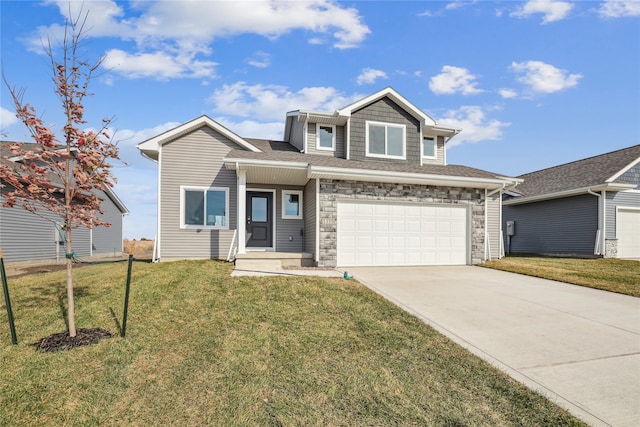 view of front facade with a front yard and a garage