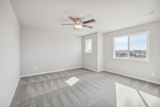 unfurnished room featuring carpet flooring and ceiling fan