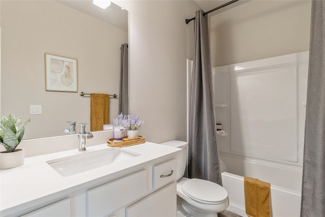 full bathroom with vanity, shower / tub combo with curtain, and toilet