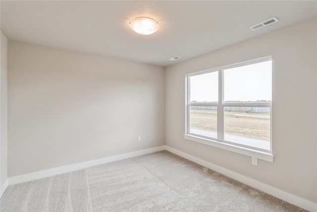 spare room featuring carpet flooring