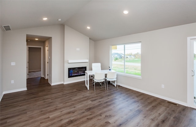 interior space with lofted ceiling and dark hardwood / wood-style floors