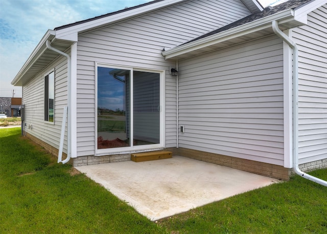 exterior space with a patio and a yard