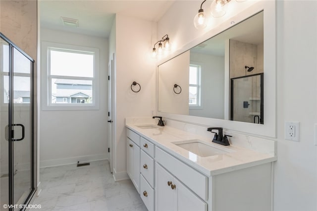 bathroom with vanity and an enclosed shower