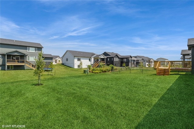 view of yard featuring a wooden deck