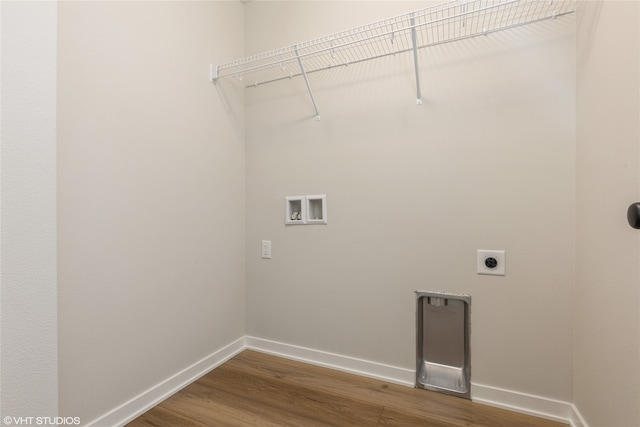 washroom with hardwood / wood-style flooring, washer hookup, and hookup for an electric dryer