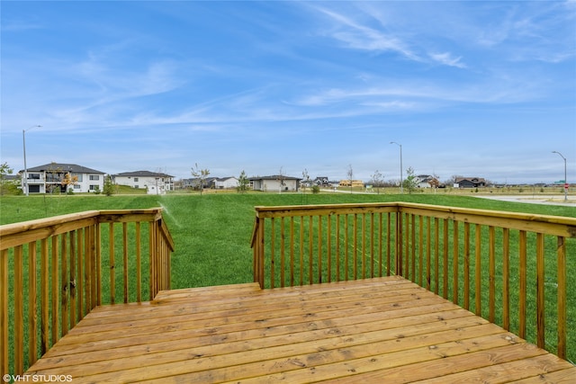 wooden terrace with a yard