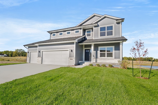 craftsman inspired home featuring a garage and a front lawn