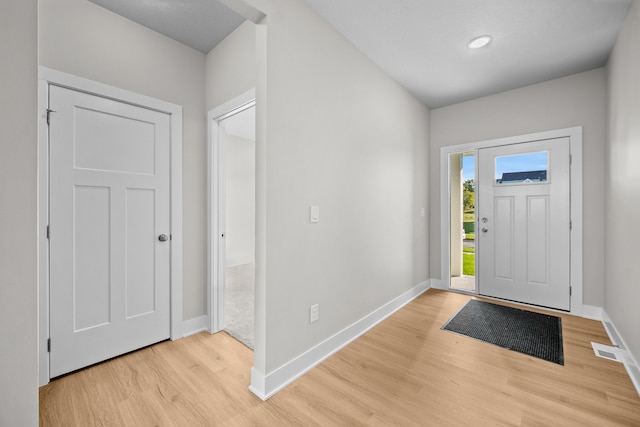 entrance foyer with light hardwood / wood-style flooring