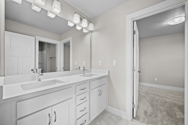 bathroom featuring vanity and a textured ceiling