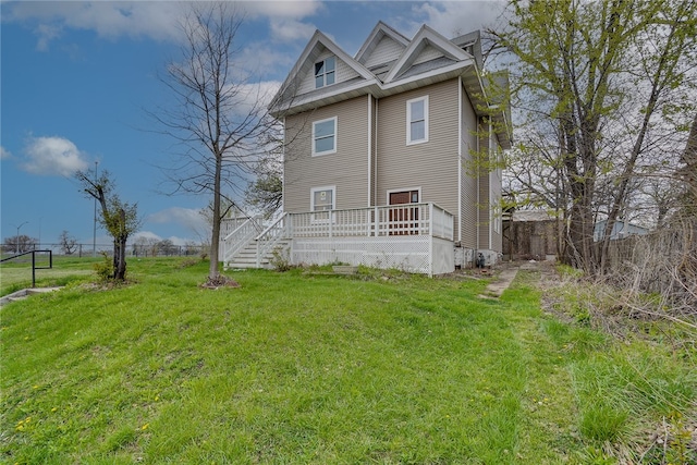 back of house with a lawn