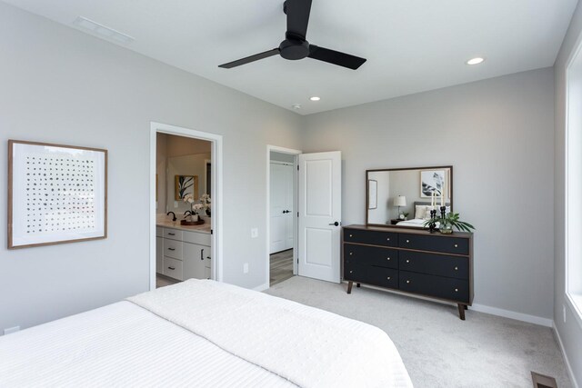 2738 Fleur Dr Unit 23, Des Moines, IA 50321 - bedroom featuring light colored carpet, connected bathroom, recessed lighting, a ceiling fan, and baseboards