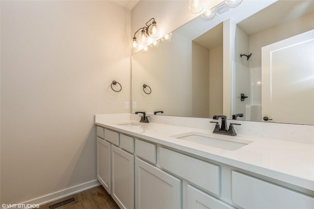 bathroom with shower / tub combination, vanity, and hardwood / wood-style flooring