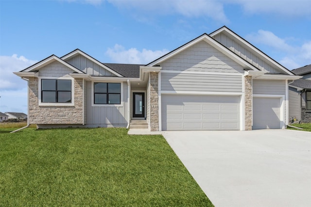 view of front of property with a garage and a front lawn