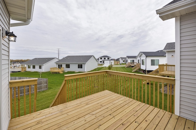 wooden terrace with a yard