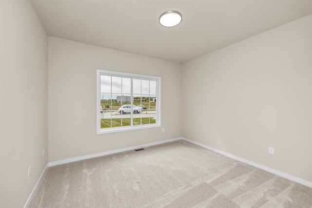 empty room featuring carpet floors